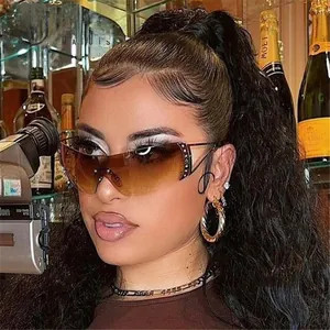 Close-up of Y2K rimless sports sunglasses with brown gradient lenses and rivet detail
