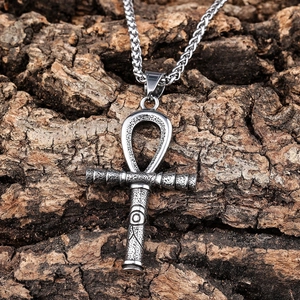 Vintage silver Ankh cross necklace in stainless steel with mystic totem on bark background