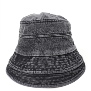 Detail of washed denim bucket hat showing vintage grey texture and reinforced stitching
