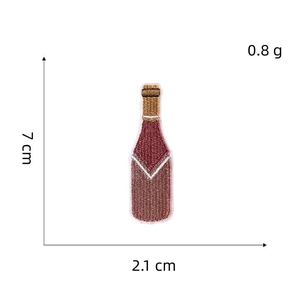 Detailed view of a wine bottle embroidery patch with height and width measurements