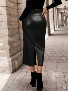 Close-up back view of a slim fit black PU leather skirt with an elegant slit detail