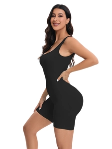Close-up of seamless black ribbed bodysuit showing moisture-wicking compression fabric texture