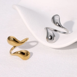 Polished stainless steel water drop open rings in gold and silver finish set on minimalist base