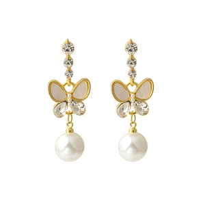 Elegant gold butterfly earrings with long pearl drop and sparkling rhinestone accents