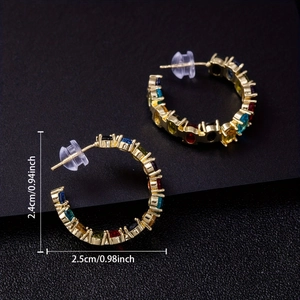 Rainbow gemstone C-shaped hoop earrings with gold base in a 45-degree angle view