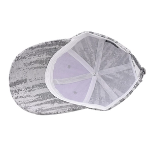 Internal view of thick checkered baseball cap showing 6-panel stitching and white seam tape