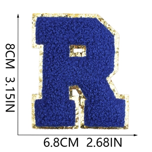 Detailed size view of royal blue chenille letter R patch with gold glitter borders