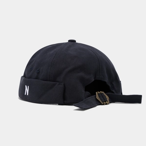Detailed view of N letter embroidery on dark canvas miki hat with adjustable back strap