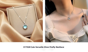 Silver firefly necklace with iridescent gemstone shown on silk and worn by a model