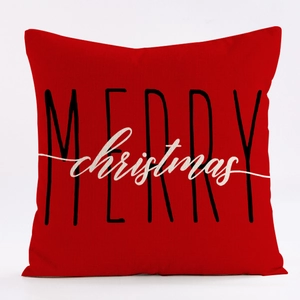 Close-up of red linen Christmas pillowcase with MERRY christmas text on white background