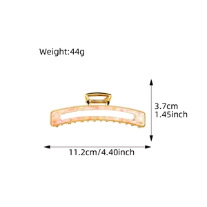 Pink marble acetate hair claw clip in gold metal frame with 11.2cm size measurements