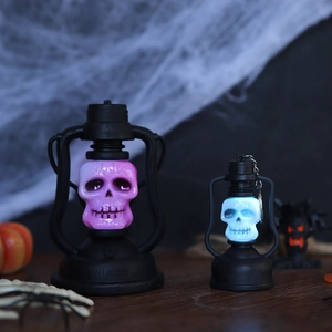 Black Halloween skeleton lanterns with LED glowing skulls for holiday party decoration