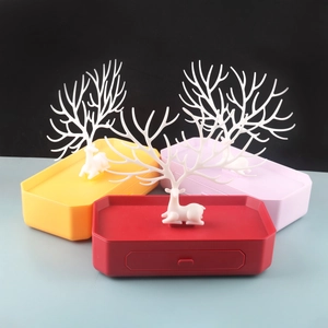 Antler tree jewelry organizer with drawer base in yellow, red, and pink plastic