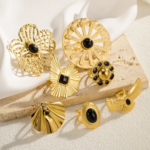 7-piece vintage gold-plated titanium steel ring set with black stones on travertine