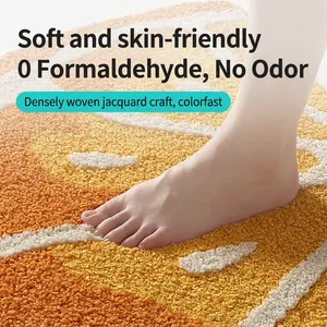Plush non-slip fruit pattern bathroom rug with thick absorbent orange and white jacquard fibers