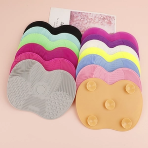 Silicone makeup brush cleaning mat with multi-textured zones and suction cups for deep cleansing