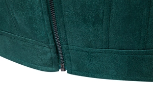 Detail of dark green faux suede jacket featuring a metallic zipper and reinforced stitching