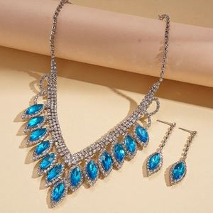 Detail view of pear-cut blue crystal fringe necklace and stud earrings jewelry set