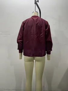 Back view of a burgundy reversible bomber jacket with ribbed cuffs and hem details