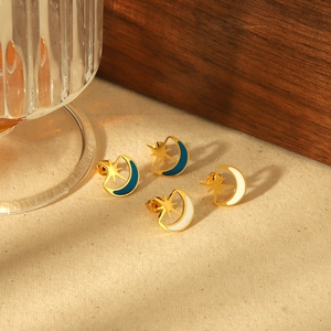 Vintage 18k gold plated moon and star stud earrings with blue and white enamel inlay