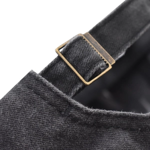 Detail of adjustable metal buckle and vintage washed cotton fabric on the baseball cap