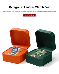 Detail view of open octagonal leather watch boxes in orange and dark green finish