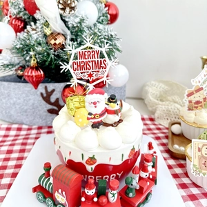 Detailed Christmas cake topper set with Merry Christmas sign, Santa, and festive mini train