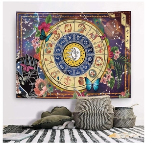 Detail of bohemian zodiac tapestry featuring astrological signs and symbols in a home setting