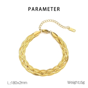 Detail of woven triple flat snake chain bracelet in gold finish with lobster clasp closure