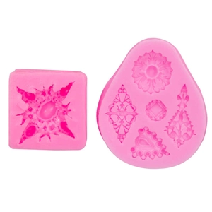 Detailed pink silicone molds for vintage jewelry reliefs and diamond pattern baking