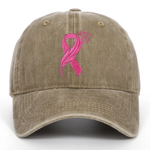 Close-up of pink ribbon feather embroidery on washed cotton twill baseball cap