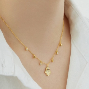 Collier Main de Fatma en argent S925 doré avec œil bleu et zircons étincelants
