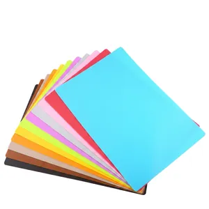 Detailed stack of multi-colored rectangular silicone mats for kitchen and dining use