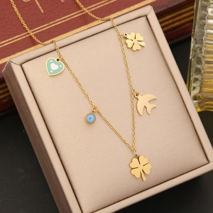 Golden stainless steel necklace with clover, blue heart, evil eye, and bird charms