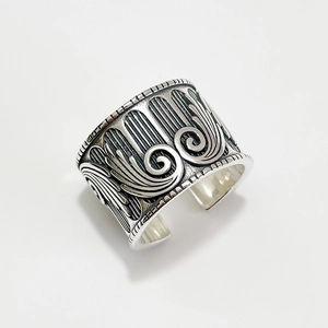 Vintage 925 sterling silver wide open ring featuring detailed angel wing relief carvings