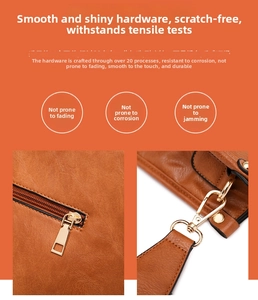Detail of premium golden hardware and smooth zipper on the brown leather tote bag