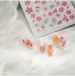 Detailed 3D embossed cherry blossom nail stickers with pink and white floral patterns