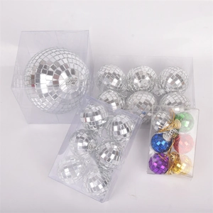 Various sized silver and colorful disco mirror ball ornaments for cake and party decor