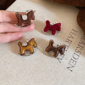 Elegant rocking horse brooch set with velvet resin and rhinestones in four vintage styles