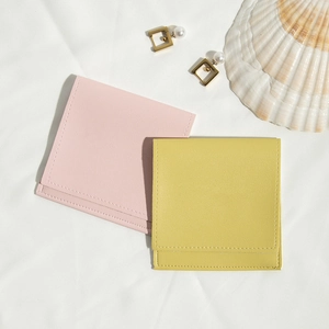 Pink and yellow PU leather drawstring pouches with shell and earring accessories
