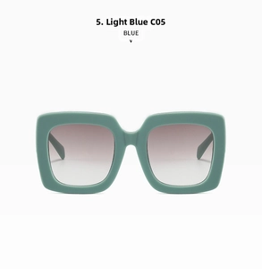 Detail of light blue oversized square sunglasses with premium grey gradient lenses