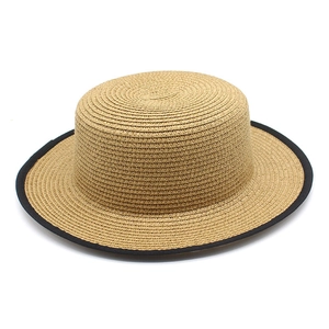 Classic straw boater hat with flat top and black trim for summer sun protection