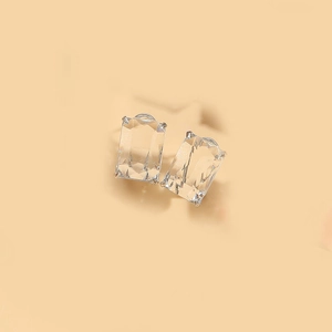 Detail of square-cut crystal earrings with silver-tone four-prong setting