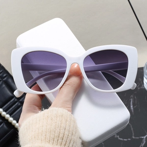 Chic white cat-eye sunglasses with purple gradient lenses for a high-end fashion look