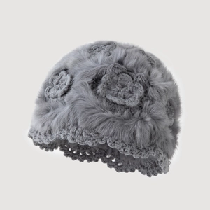 Grey knitted winter hat with plush faux fur texture and three floral decorations