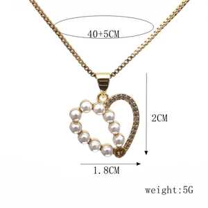 Detail showing gold heart necklace dimensions 40+5cm with pearl and micro-pave zircon