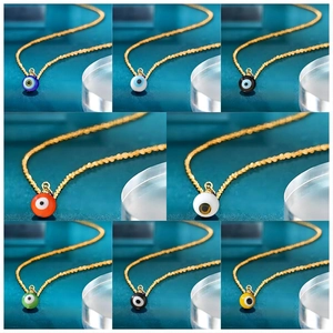Detail showing eight vibrant colors of evil eye bead charms on gold stainless steel chains