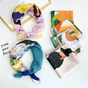 Silk satin square scarves with colorful digital prints on minimalist white background