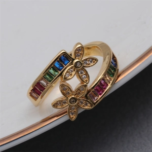 Gold flower open ring with rainbow zircon crystals shown from a 45-degree angle