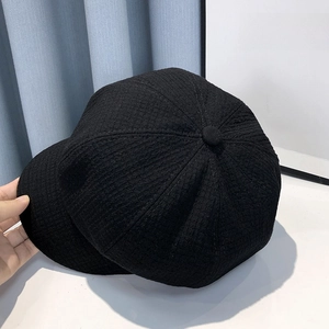 Classic black tweed newsboy cap with stylish short brim and textured knit fabric for women